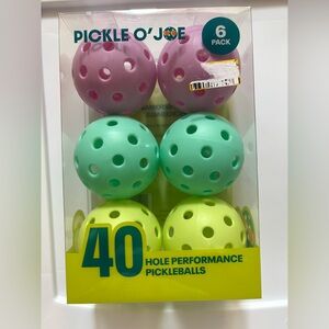 Pink, Green, and Yellow Pickleballs